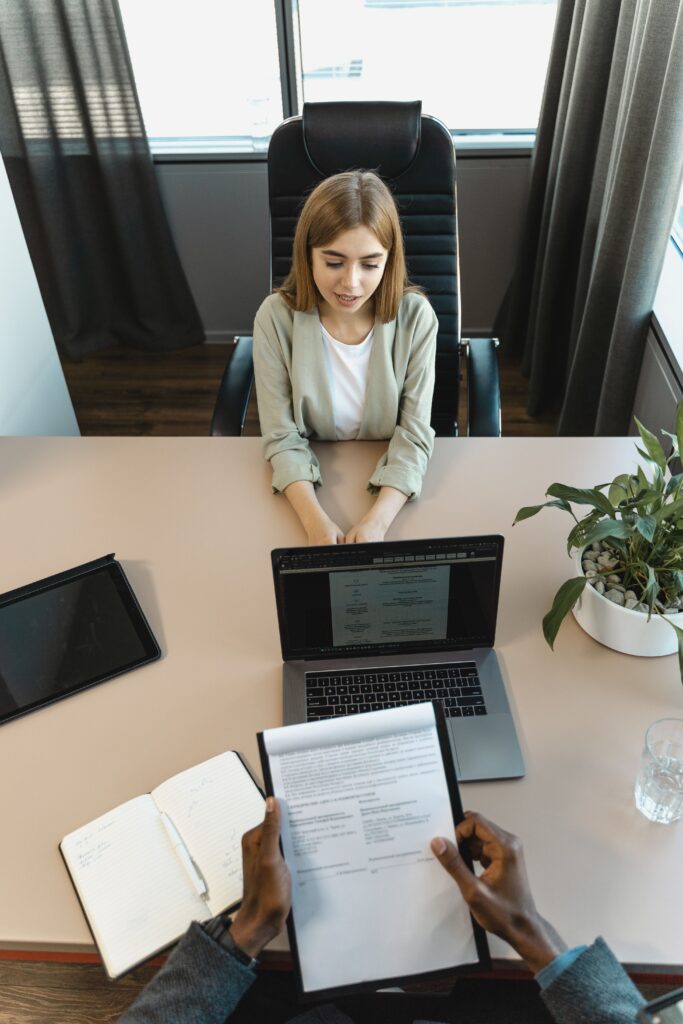 pexels photo 5439152 5439152 High-angle view of a job interview in a modern office setting, capturing professionalism.