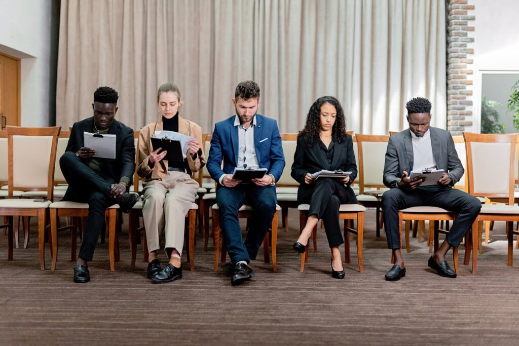 The Art of Drawing Readers In: Your attractive post title goes here A diverse group of professionals attentively reviewing documents indoors.